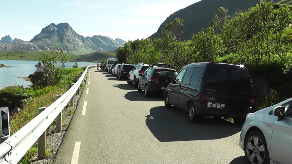 Illegal parking at the popular hikes trailheads in the Lofoten Islands. This one is from Kvalvika Beach.